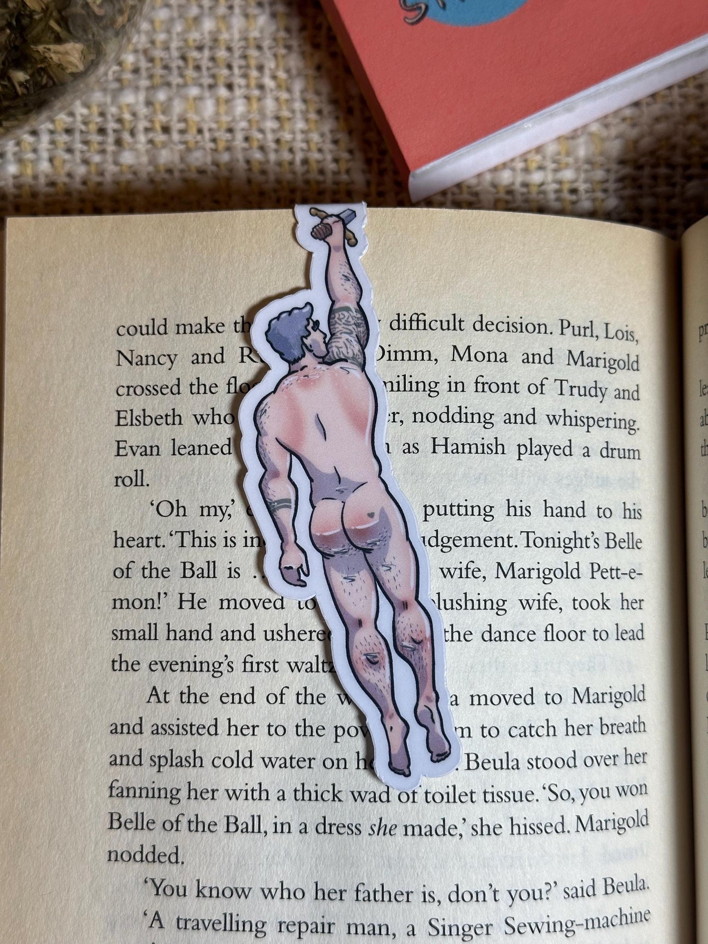 Naked man magnetic bookmark on page