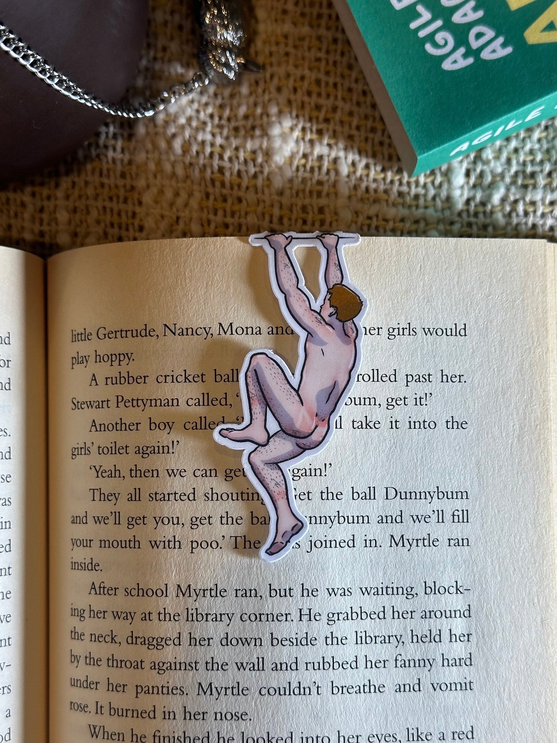 Naked man magnetic bookmark on page