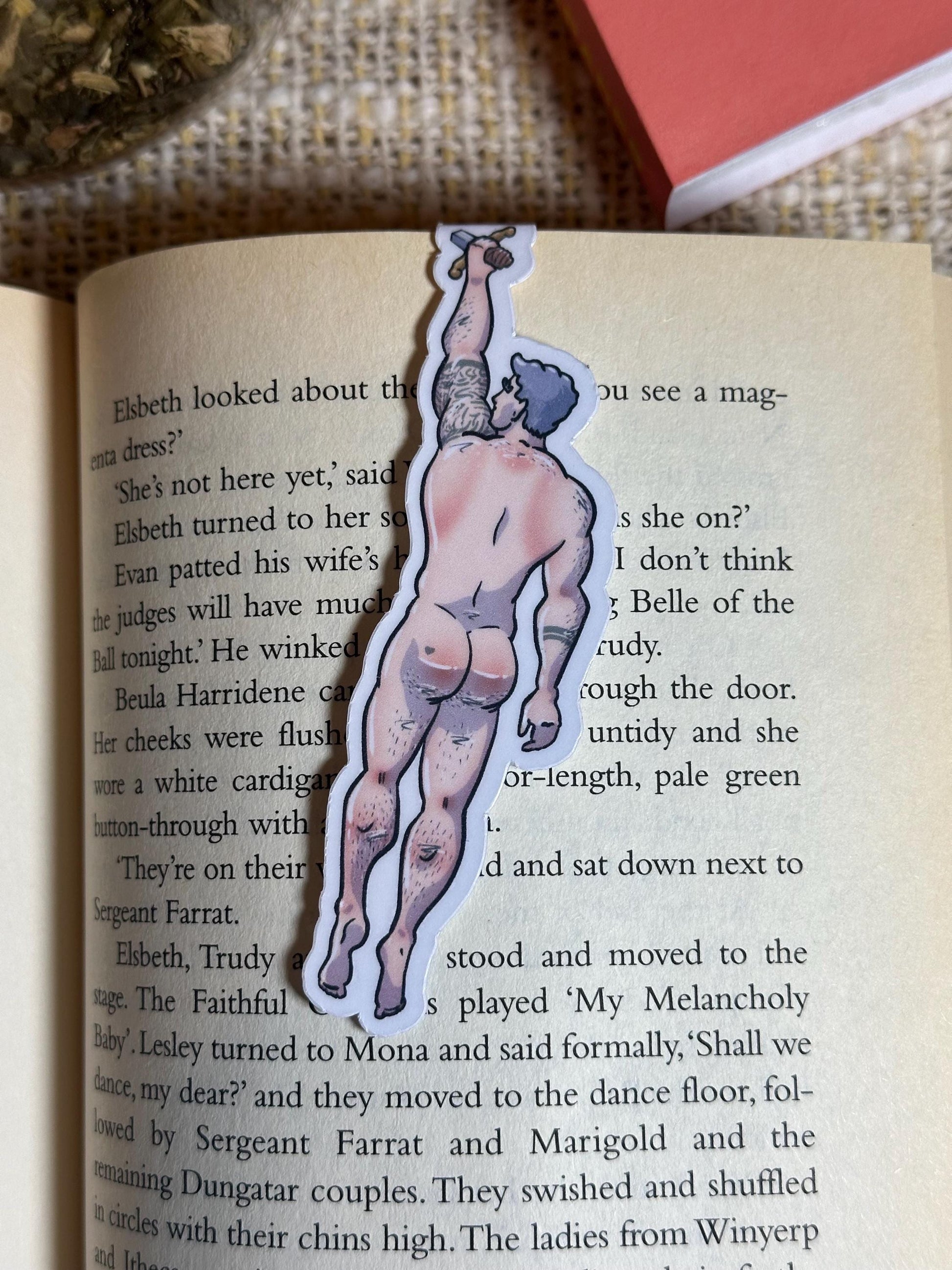 Naked man magnetic bookmark on page