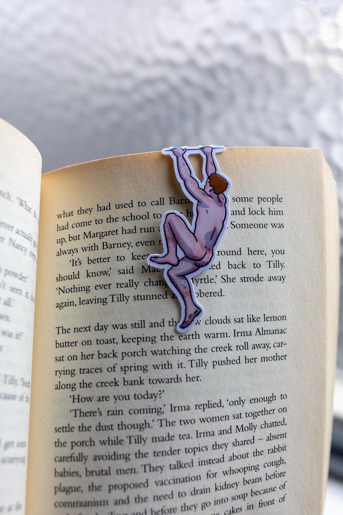 Naked man magnetic bookmark on page