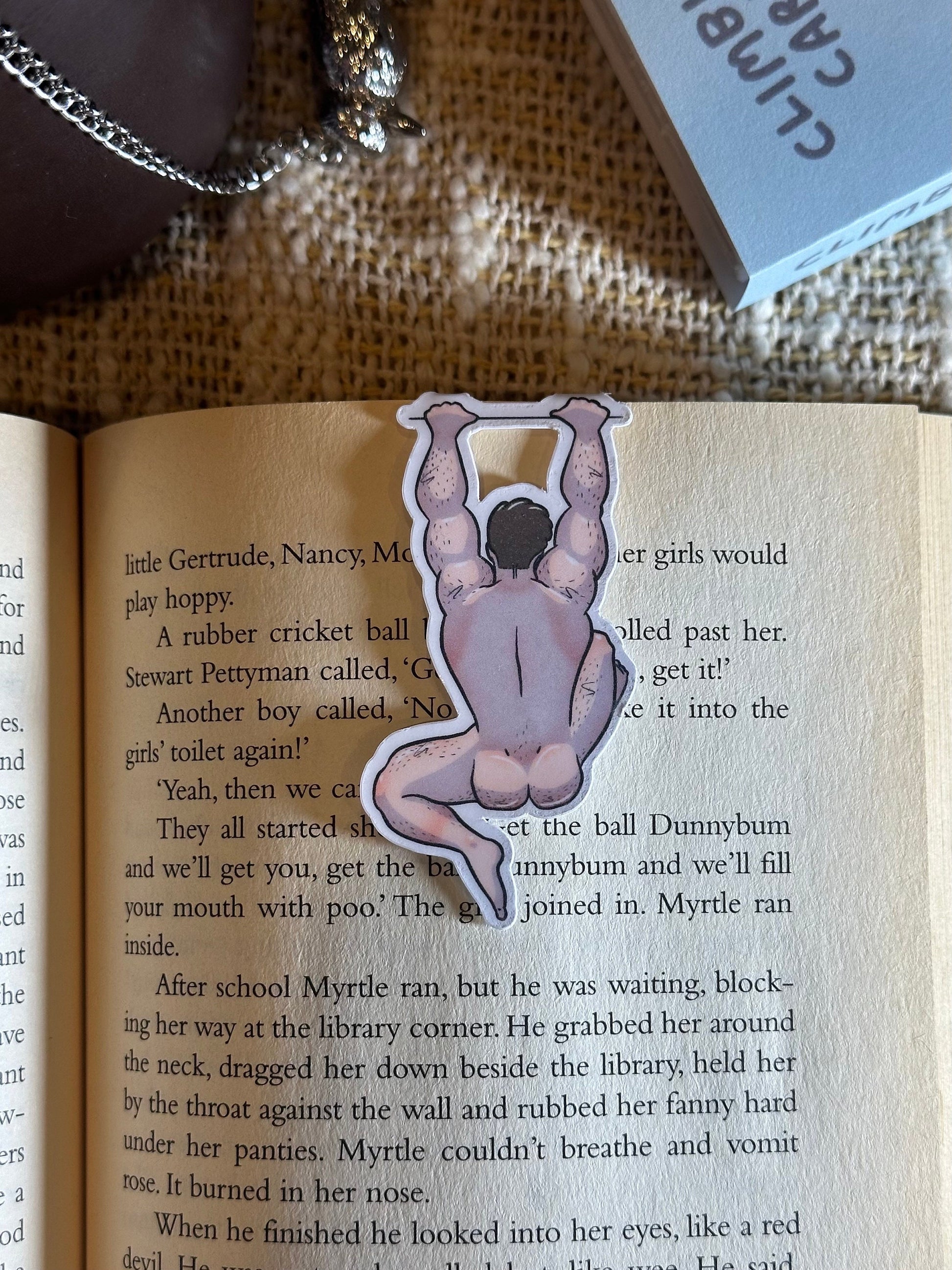 Naked man magnetic bookmark on page