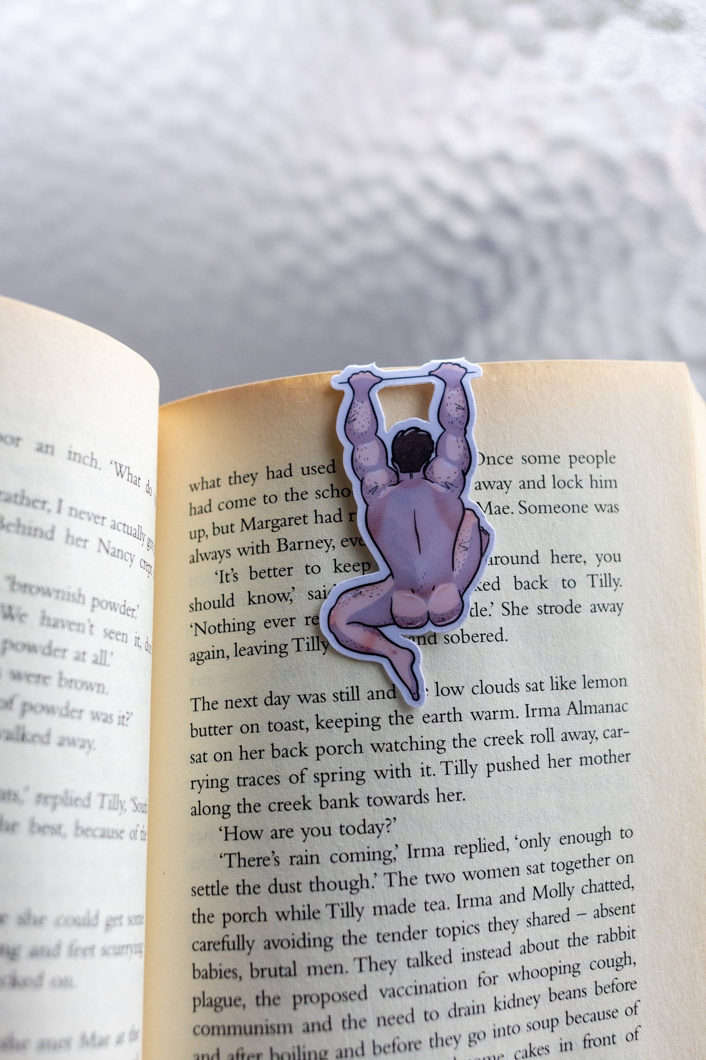 Naked man magnetic bookmark on page