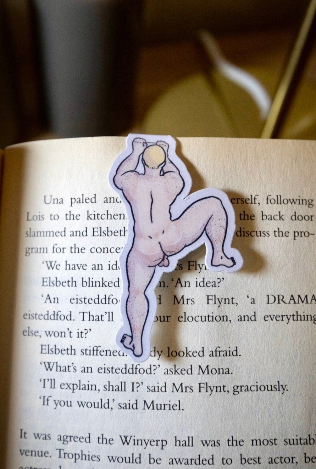 Naked man magnetic bookmark on page