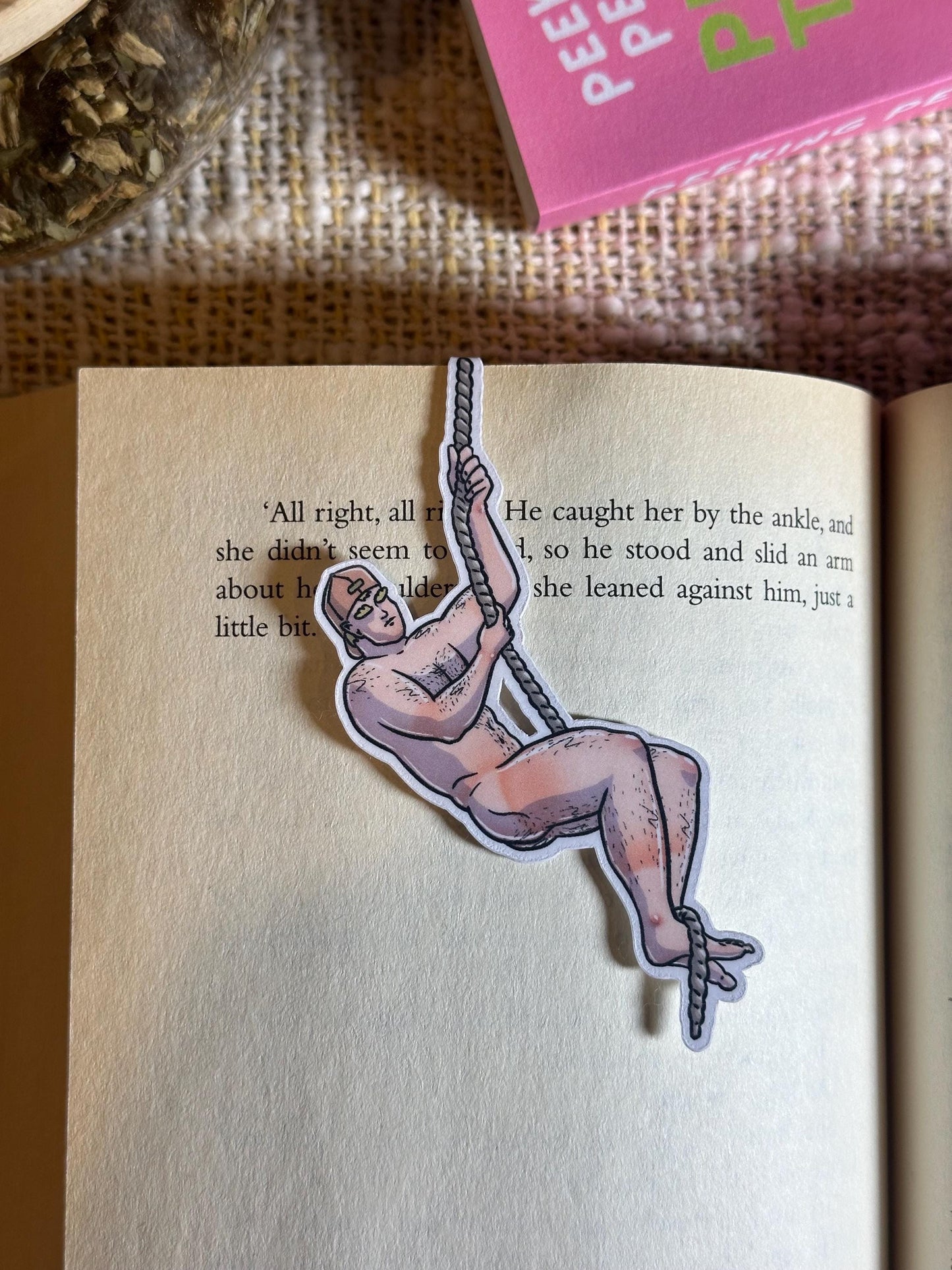 Naked man magnetic bookmark on page