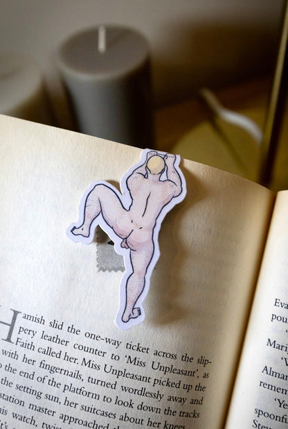 Naked man magnetic bookmark on page
