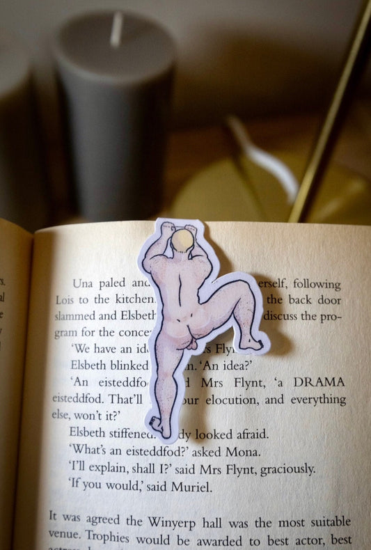 Naked man magnetic bookmark on page