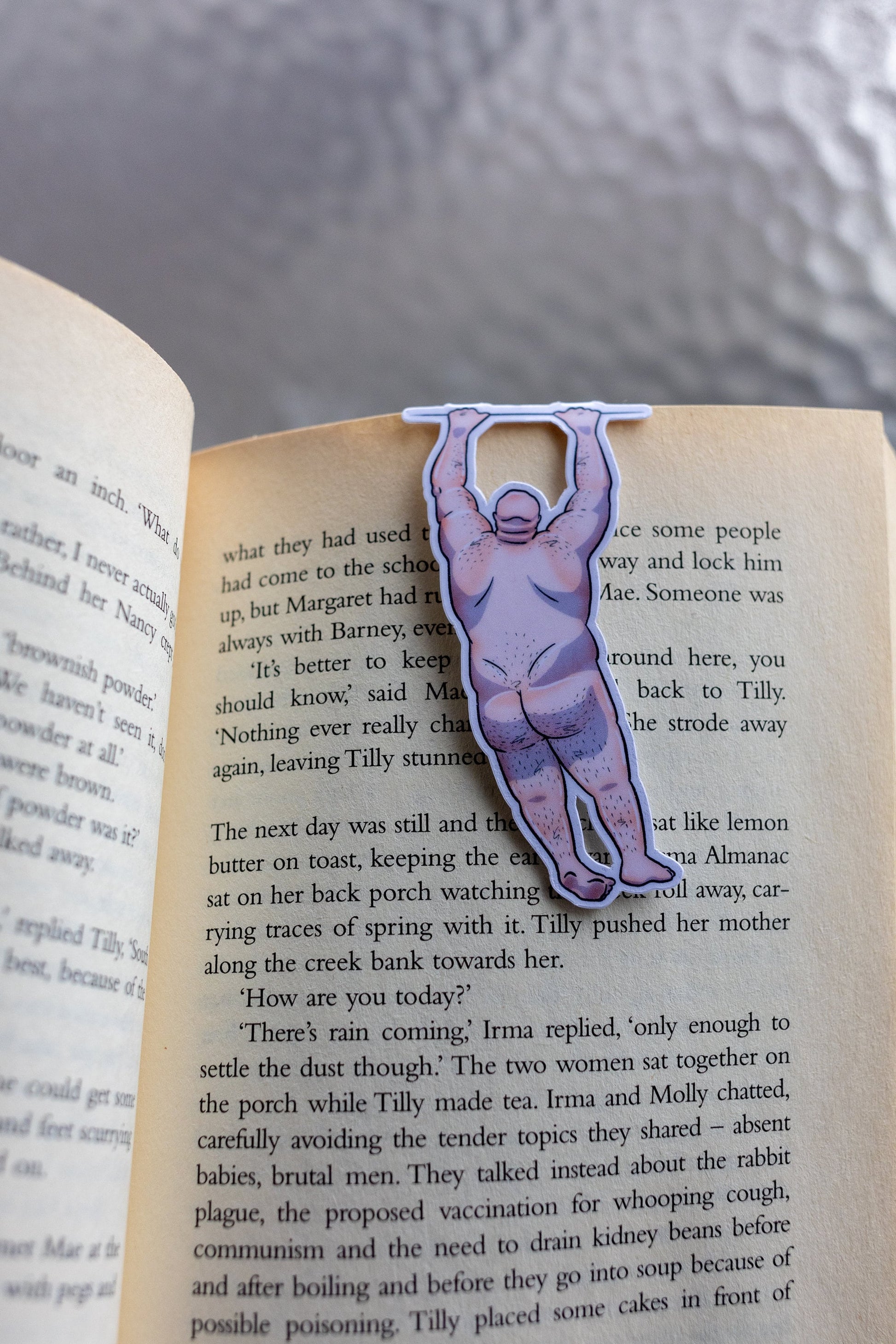 Naked man magnetic bookmark on page