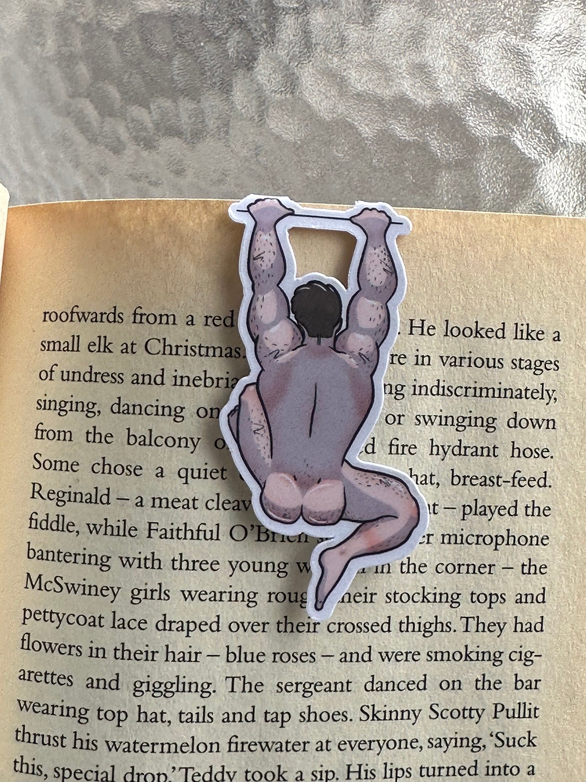 Naked man magnetic bookmark on page