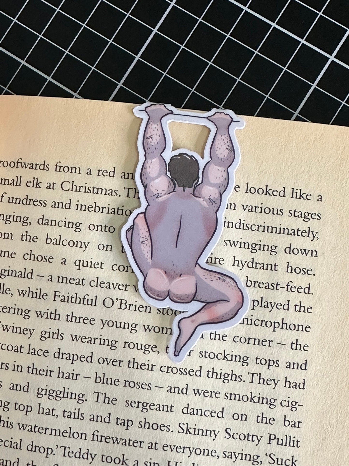 Naked man magnetic bookmark on page