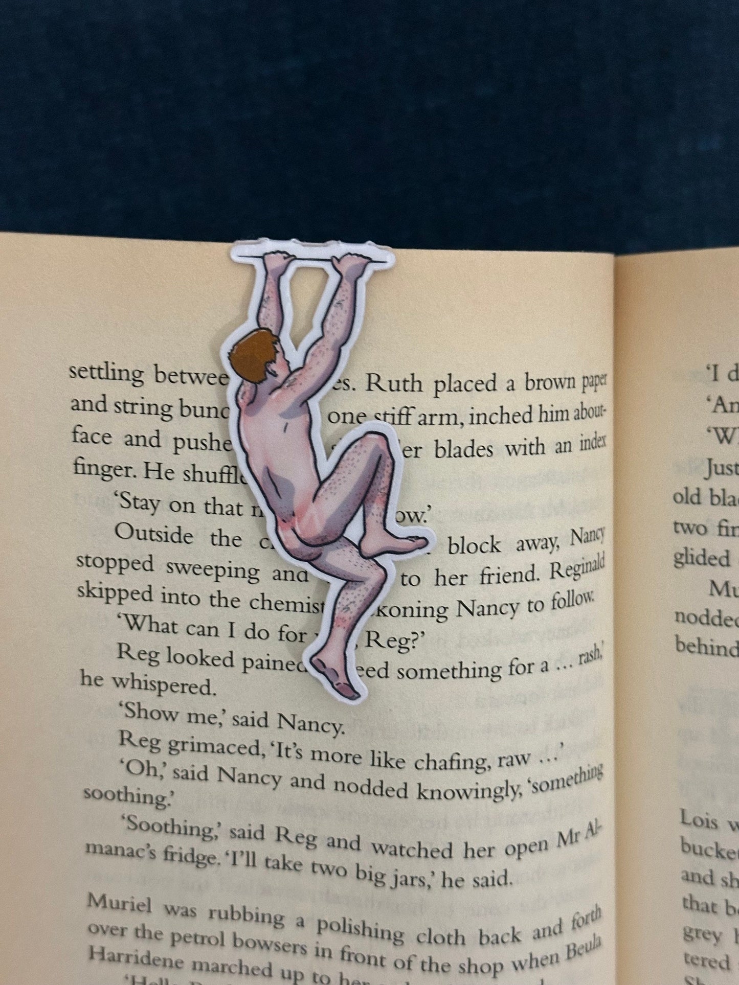 Naked man magnetic bookmark on page